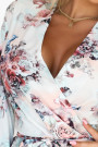  297-3 CAROLINE A flowing floral dress with a wrap neckline and ruffles 